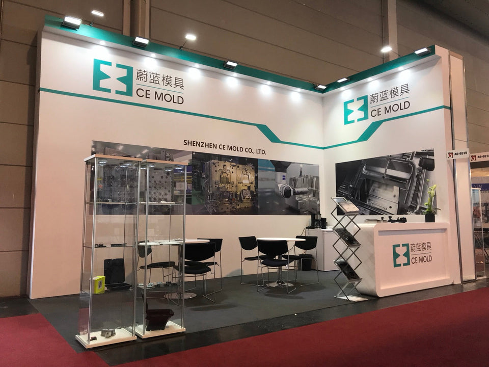 CE MOLD exhibition booth at Fakuma 2018 featuring precision mold samples and factory photography