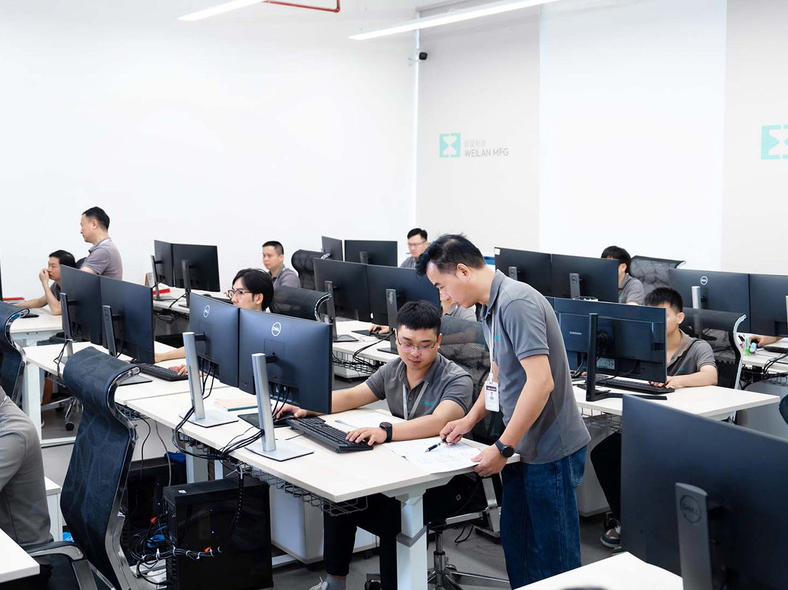 WEILAN MFG engineering team working at computer workstations